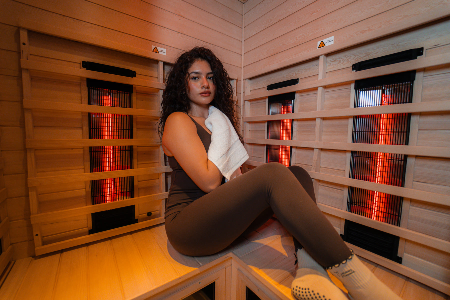 A client resting in the private infrared sauna suite