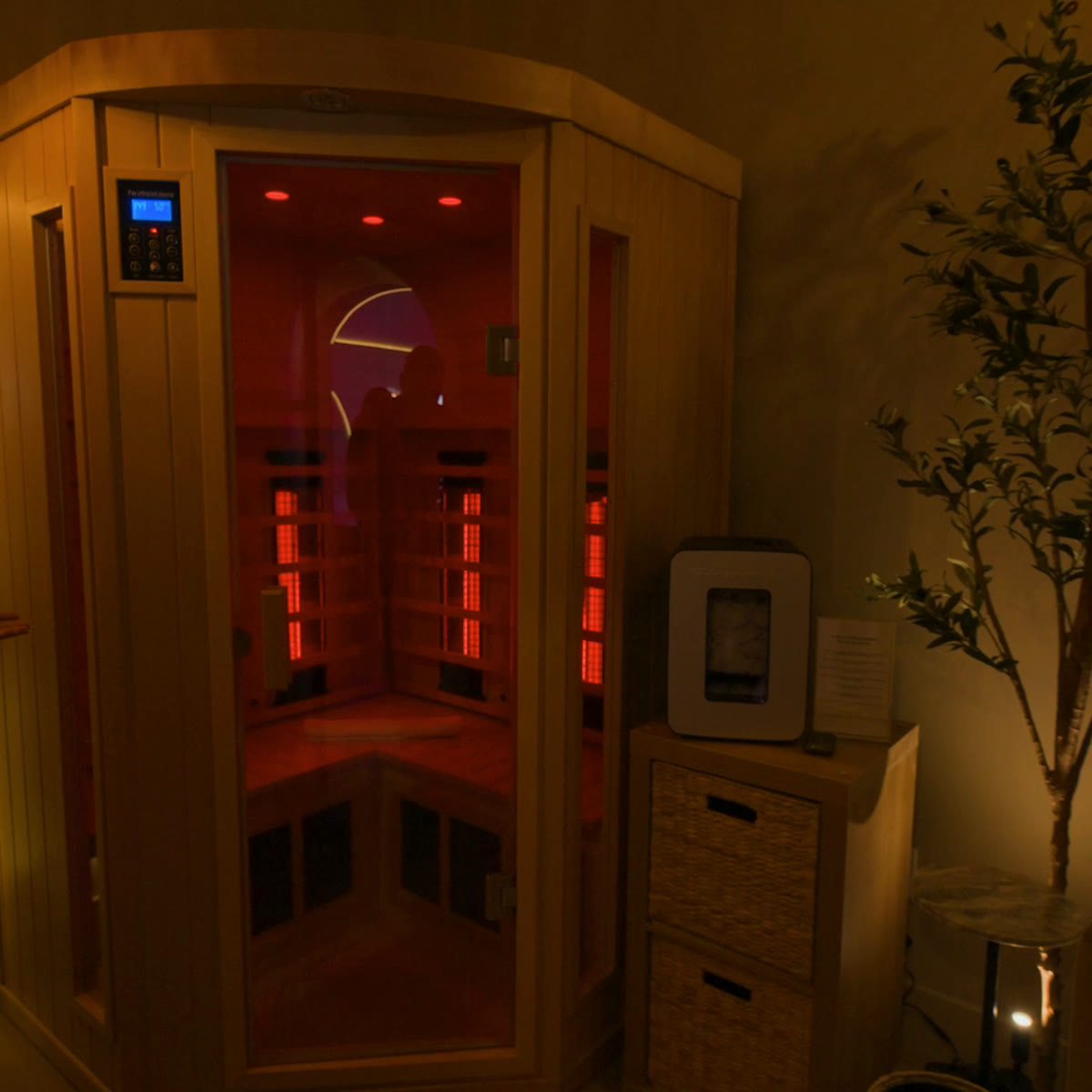The infrared sauna booth glowing red